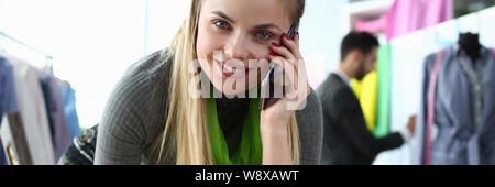 Custom Clothes Tailoring Service Designer on Phone Stock Photo