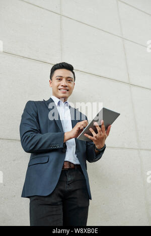 Businessman working on digital tablet Stock Photo