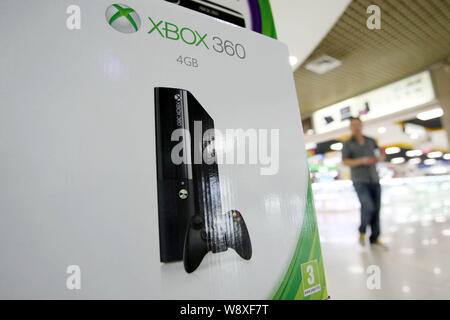 FILE--A young boy plays electronic games on an XBOX ONE game console at a  physical store of Microsoft in Shanghai, China, 26 December 2014. Produc  Stock Photo - Alamy