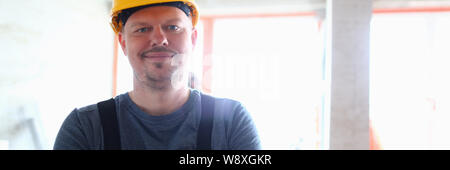 Laughing man in hardhat Stock Photo