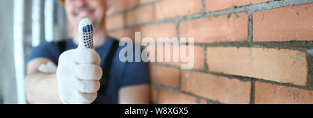 Smiling man showing thumb up Stock Photo