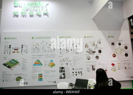 --FILE--A visitor is seen at the stand of Schneider Electric during the 1st China (Shanghai) International Technology Fair in Shanghai, China, 8 May 2 Stock Photo