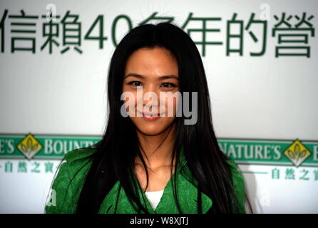 Chinese actress Tang Wei poses during a promotional event for Natures Bounty in Hong Kong, China, 27 June 2014. Stock Photo