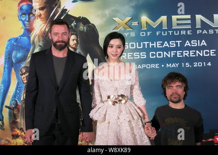 (From left) Australian actor Hugh Jackman, Chinese actress Fan Bingbing and American actor Peter Dinklage pose during a press conference for their new Stock Photo