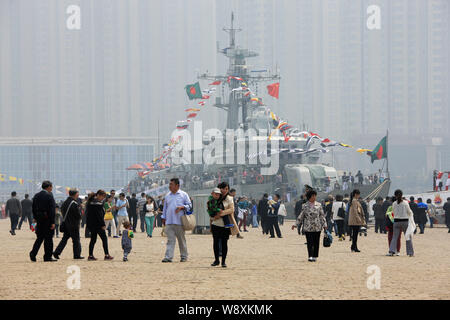 People visit the BNS Abu Bakar frigate of the Bangladesh Navy at a port during the 14th Western Pacific Naval Symposium in Qingdao city, east Chinas S Stock Photo