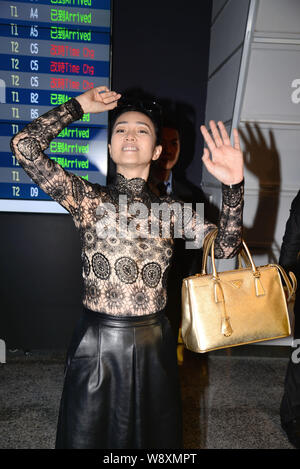 Chinese actress Gong Li waves after arriving at the Taoyuan International Airport for the 51st Taipei Golden Horse Film Festival in Taipei, Taiwan, 20 Stock Photo