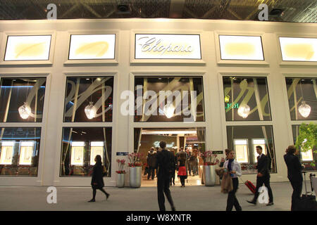 People visit the stand of Chopard during the Baselworld Watch and