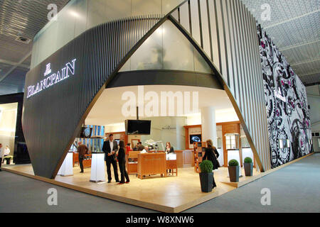 People visit the stand of Blancpain during the Baselworld Watch