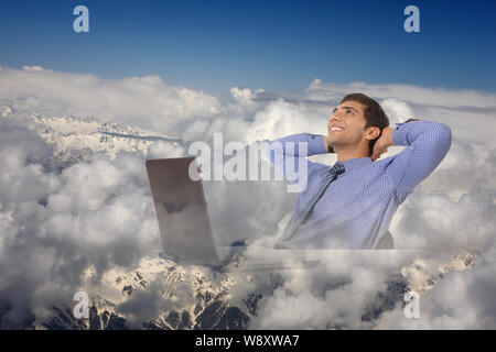 Businessman relaxing with head in hands Stock Photo