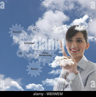 Businesswoman using new technology Stock Photo