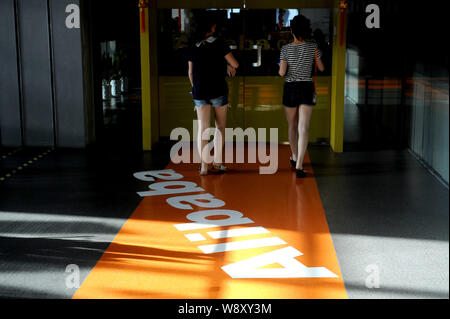 --FILE--People visit the the headquarters of Alibaba Group in Hangzhou city, east Chinas Zhejiang province, 20 August 2013.   On Monday (16 June 2014) Stock Photo