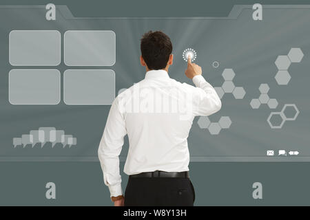 Businessman using a touch screen Stock Photo