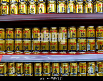 --FILE--Cans of Red Bull energy drink are for sale at a supermarket in Yichang city, central Chinas Hubei province, 17 April 2014.    Vita Coco, the b Stock Photo