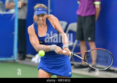 Shahar Peer of Israel returns a shot to Alize Cornet of France at their second round match of the women's singles during the 2014 WTA Guangzhou Open t Stock Photo