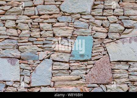 Stone wall cladding home natural stone background close up Stock Photo
