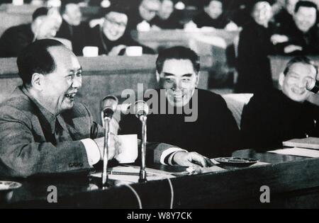 This picture shows a photos of Mao Zedong, left, founding father of ...