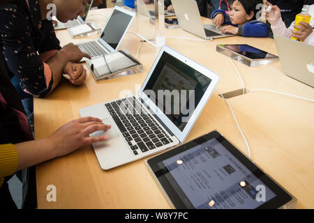 A Customer at an Apple Store Looking at His IPhone while Waiting at an Apple  Store Editorial Photo - Image of imac, computer: 237668441