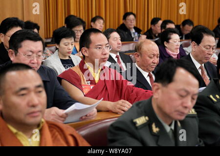 The 11th Panchen Lama Bainqen Erdini Qoigyijabu (or Erdeni Gyaincain Norbu), center, sits among other attendants at the opening meeting of the Second Stock Photo