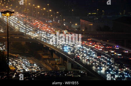 Night view of highways and roads overcrowded by masses of vehicles during a traffic jam at CBD (Central Business District) on World Car-Free Day in Be Stock Photo