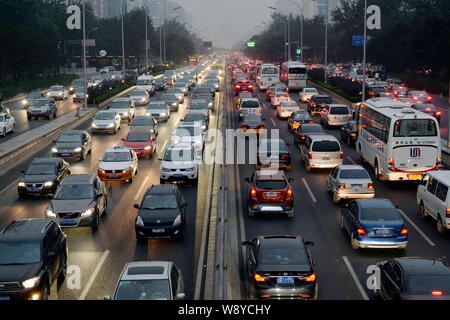 Night view of highways and roads overcrowded by masses of vehicles during a traffic jam at CBD (Central Business District) on World Car-Free Day in Be Stock Photo