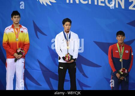 (From left) Silver medalist Sun Yang of China, gold medalist Kosuke Hagino of Japan and Park Tae-Hwan of South Korea pose at the award ceremony of the Stock Photo