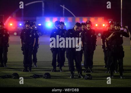 Special police officers armed with guns gather at the base camp of Beijings Special Police Force Corp. before a city patrol in Beijing, China, 8 May 2 Stock Photo