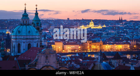 Prague, Czech Republic - March 11, 2019: Sunrise view St Nicholas Church and the old town of Prague from Hradcany.