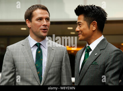 English football star Michael Owen, left, talks with Hong Kong singer and actor Aaron Kwok at the Kent & Curwen Centenary Sprint Cup horse race in Hon Stock Photo