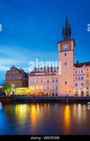 Prague, Czech Republic - March 13, 2019: Evening view of Old Town Water Tower and river Vltava.
