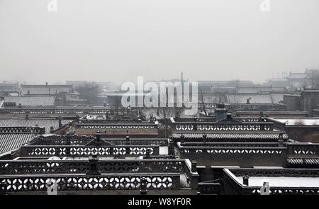Snowscape of old buildings in Ancient City of Ping Yao in Pingyao county, north Chinas Shanxi province, 1 December 2012. Stock Photo