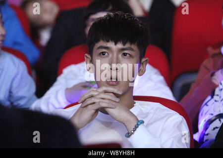 --FILE--Taiwanese actor Kai Ko watches a performance during Jackie Chan's 60th birthday charity concert in Beijing, China, 6 April 2014.   Taiwanese a Stock Photo