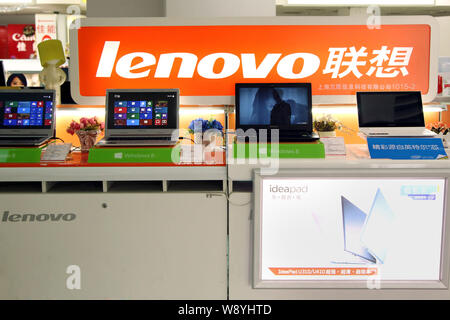 --FILE--Laptop computers of Lenovo are for sale at a store in Shanghai, China, 22 January 2014.   Worldwide personal-computer shipments fell 1.7 perce Stock Photo