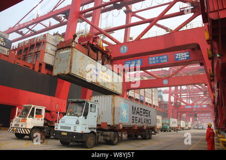 --FILE--Containers are being lifted on a quay at the Port of Ningbo in Ningbo city, east Chinas Zhejiang province, 20 December 2013.   China replaced Stock Photo