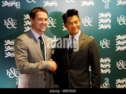 English football star Michael Owen, left, shakes hands with Hong Kong singer and actor Aaron Kwok at the Kent & Curwen Centenary Sprint Cup horse race Stock Photo