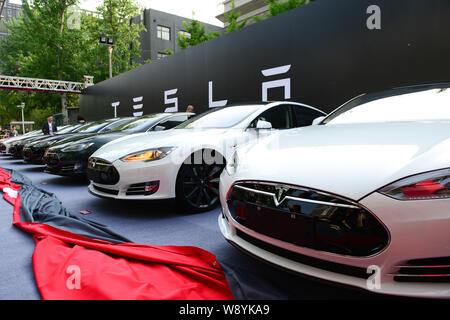 Tesla Model S electric cars to be delivered are lined up during a delivery ceremony in Beijing, China, 22 April 2014.   Tesla Motors Inc. delivered it Stock Photo