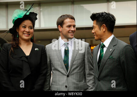 English football star Michael Owen, center, talks with Hong Kong singer and actor Aaron Kwok, right, at the Kent & Curwen Centenary Sprint Cup horse r Stock Photo