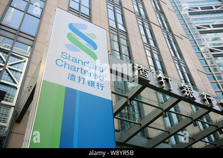 --FILE--View of the office building of Standard Chartered Bank at the Lujiazui Financial District in Pudong, Shanghai, China, 11 March 2014.   A group Stock Photo