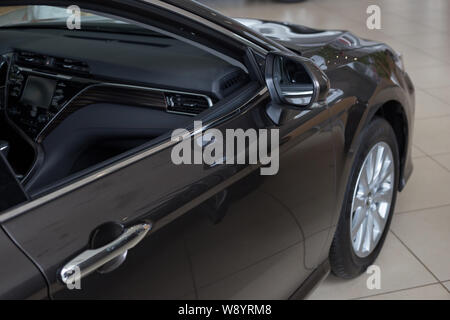 Russia, Izhevsk - July 18, 2019: Toyota showroom. New modern car in dealer showroom. Famous world brand. Stock Photo