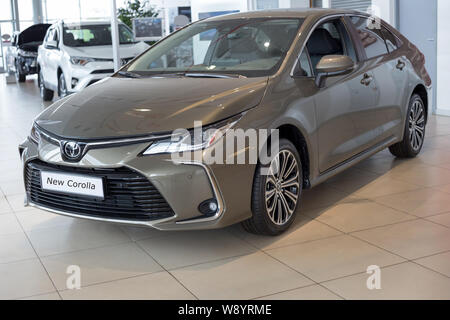 Russia, Izhevsk - July 18, 2019: Toyota showroom. Modern new car Toyota Corolla. Famous world brand. Stock Photo