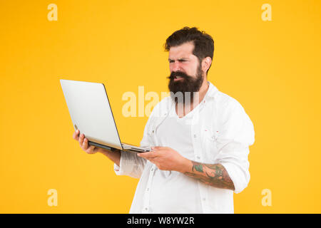 Digital world. Successful developer. Online shopping. Programmer with laptop Surfing internet. Online payment. Online purchase. Man using notebook. Programming concept Bearded man with notebook. Stock Photo