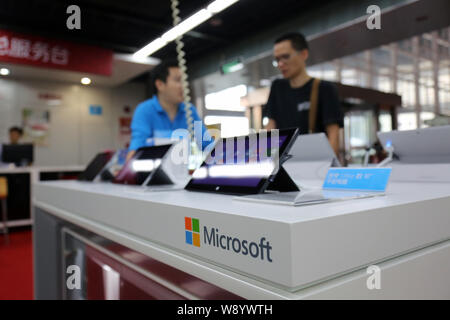 --FILE--Microsoft Surface Pro tablet PCs are for sale at a store in Shanghai, China, 29 September 2014.   Microsoft Corp. was identified by Reuters ha Stock Photo