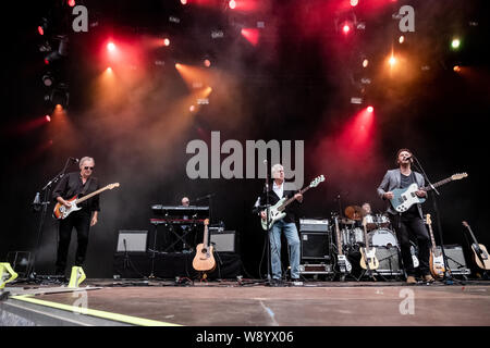 Skanderborg, Denmark. 09th, August 2019. The English band 10cc performs a live concert during the Danish music festival SmukFest 2019 in Skanderborg. Here vocalist and bass player Graham Gouldman is seen live on stage with the rest of the band. (Photo credit: Gonzales Photo - Kim M. Leland). Stock Photo