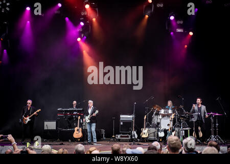 Skanderborg, Denmark. 09th, August 2019. The English band 10cc performs a live concert during the Danish music festival SmukFest 2019 in Skanderborg. Here vocalist and bass player Graham Gouldman is seen live on stage with the rest of the band. (Photo credit: Gonzales Photo - Kim M. Leland). Stock Photo