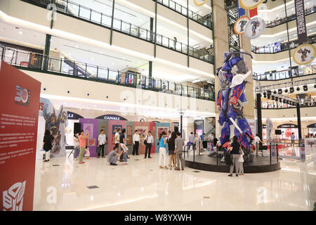 Visitors view a giant model of Optimus Prime from Hollywood movie, Transformers: Age of Extinction, during a promotional campaign for the Transformers Stock Photo