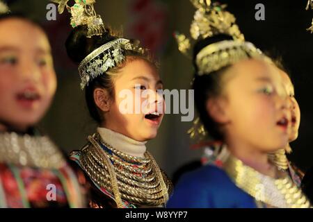 --FILE--Girls of Dong ethnic minority sing at an event in Meilin Village, Sanjiang Dong Autonomous County, south Chinas Guangxi Zhuang Autonomous Regi Stock Photo