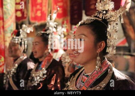 --FILE--Women of Dong ethnic minority sing at an event in Meilin Village, Sanjiang Dong Autonomous County, south Chinas Guangxi Zhuang Autonomous Regi Stock Photo