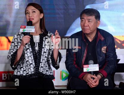 Chinese actress Zhou Xun, left, speaks during a press conference for her new TV series 'Red Sorghum' in Beijing, China, 13 October 2014. Stock Photo