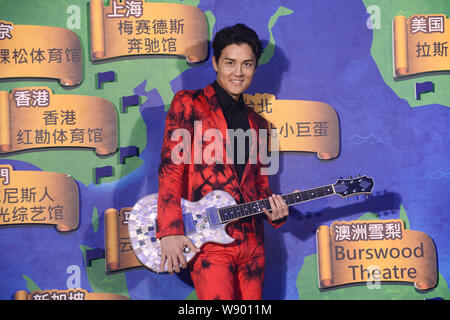 Taiwanese singer Kenji Wu poses during a press conference for joining Warner Music in Beijing, China, 2 July 2014. Stock Photo
