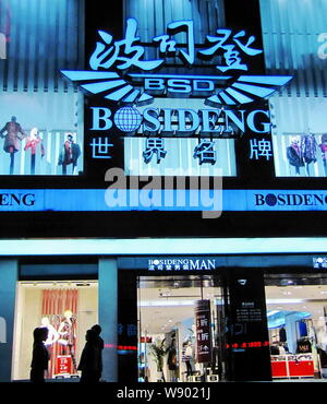 FILE Pedestrians walk past a store of Bosideng in Shanghai China