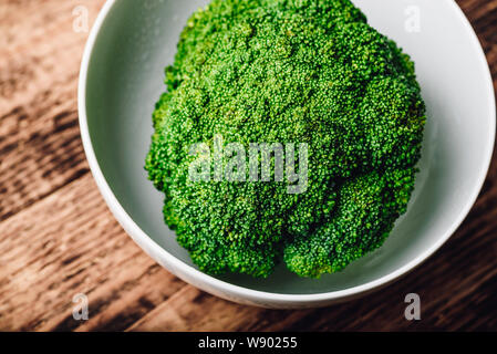Fresh broccoli in white bowl ready to be prepared for a recipe Stock Photo